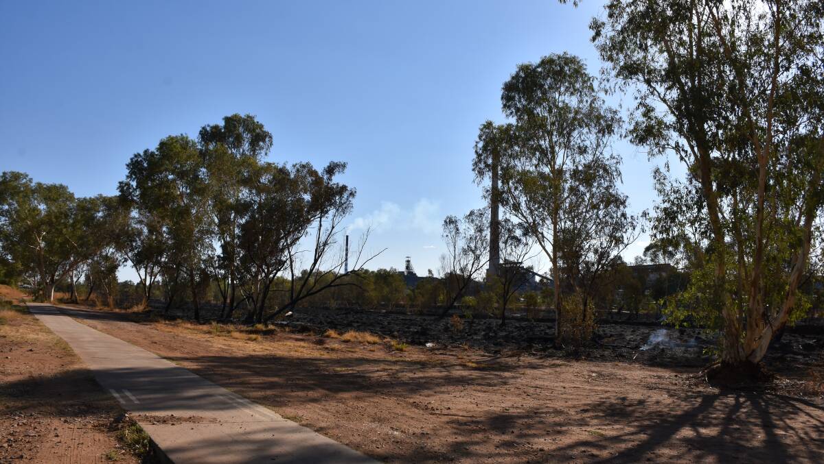 BLAZE: The burnt areas in the Leichhardt River exceeds the size of a football field, pictured near Alma Street. Photo: Samantha Campbell.