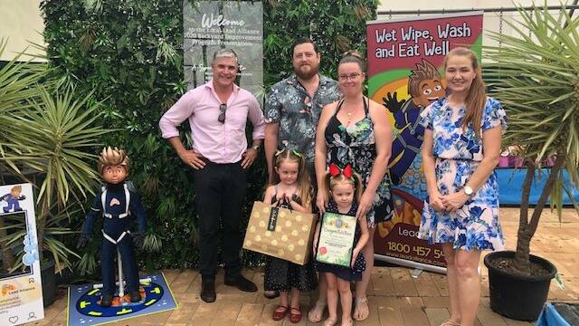 Traeger MP Robbie Katter, Lead Alliance backyard Improvement winner Emma Schneider and family, and Mount Isa City Council Mayor Danielle Slade. Photo supplied.