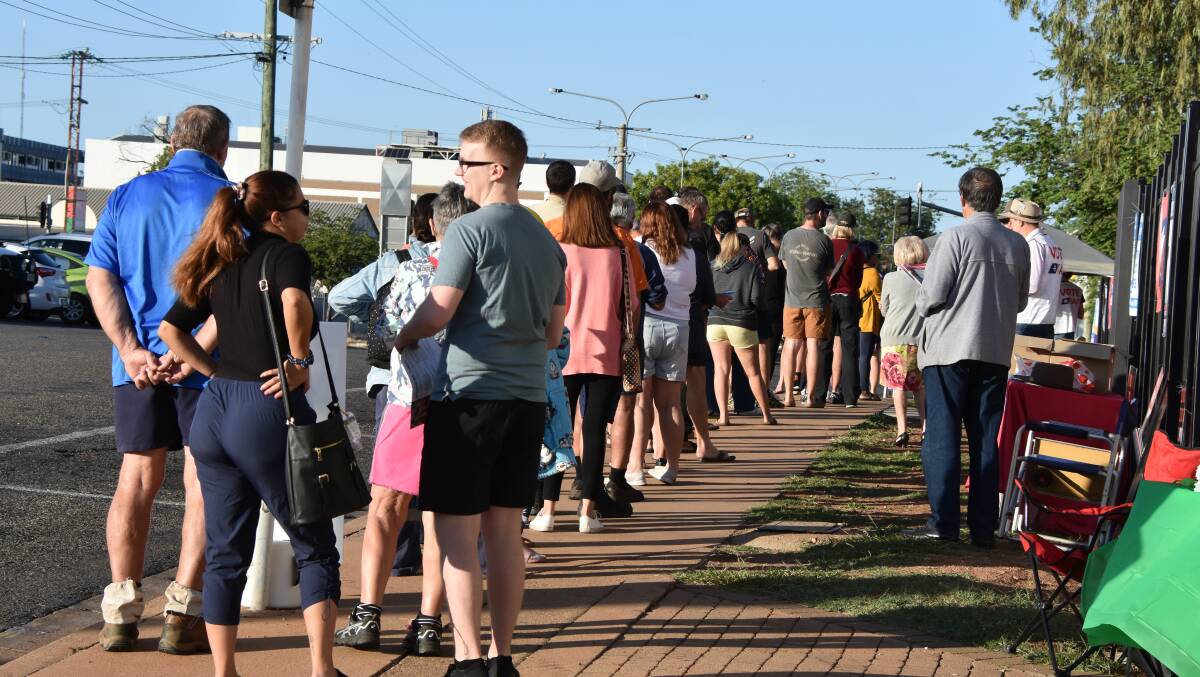 A line of constituents waiting for polling to open in Mount Isa. Photo: Samantha Campbell.