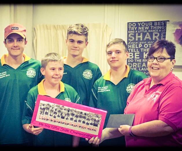 Captain Callum Jones, Nathan James, Bryce Benham, Jack O'Shea-Breed and Mount Isa and North West Queensland Breast Cancer Support Group president Trish Olsen.