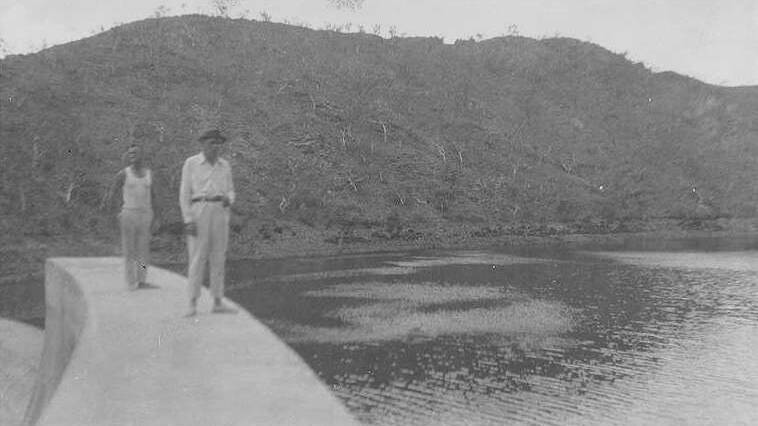 A. F. McAskill (chief mechanical engineer) and Dam Care Taker on top of Rifle Creek Dam Wall.