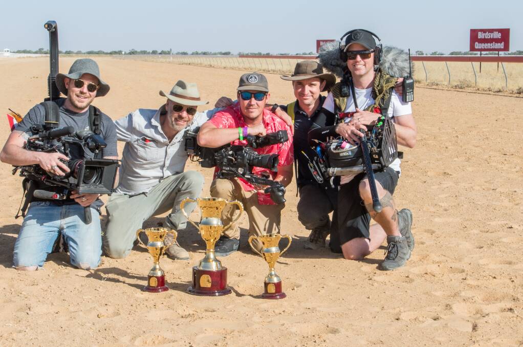 ACTION: Mint Pictures crew with the Birdsville Cup in September 2019. Photo: Fast Track Photography.