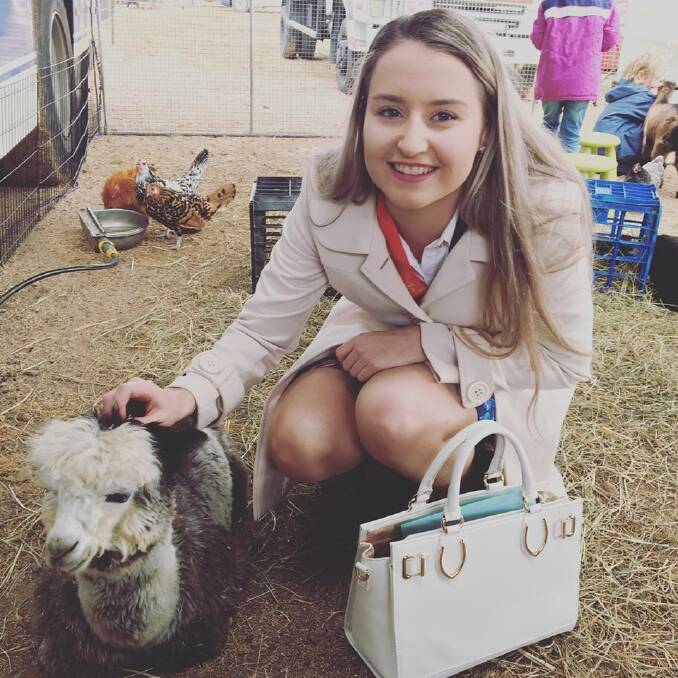 Mikaela Tapp checks out the petting zoo at Winton show. Photo supplied.