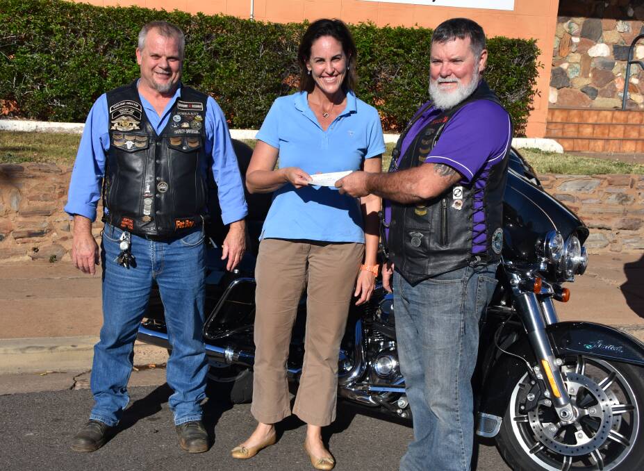 GENEROUS: Mount Isa Harley Owners Group assistant director David Schraag and treasurer Russell Holdsworth hand over the cheque to Sisters of the North founder Susan Dowling. Photo: Samantha Walton.
