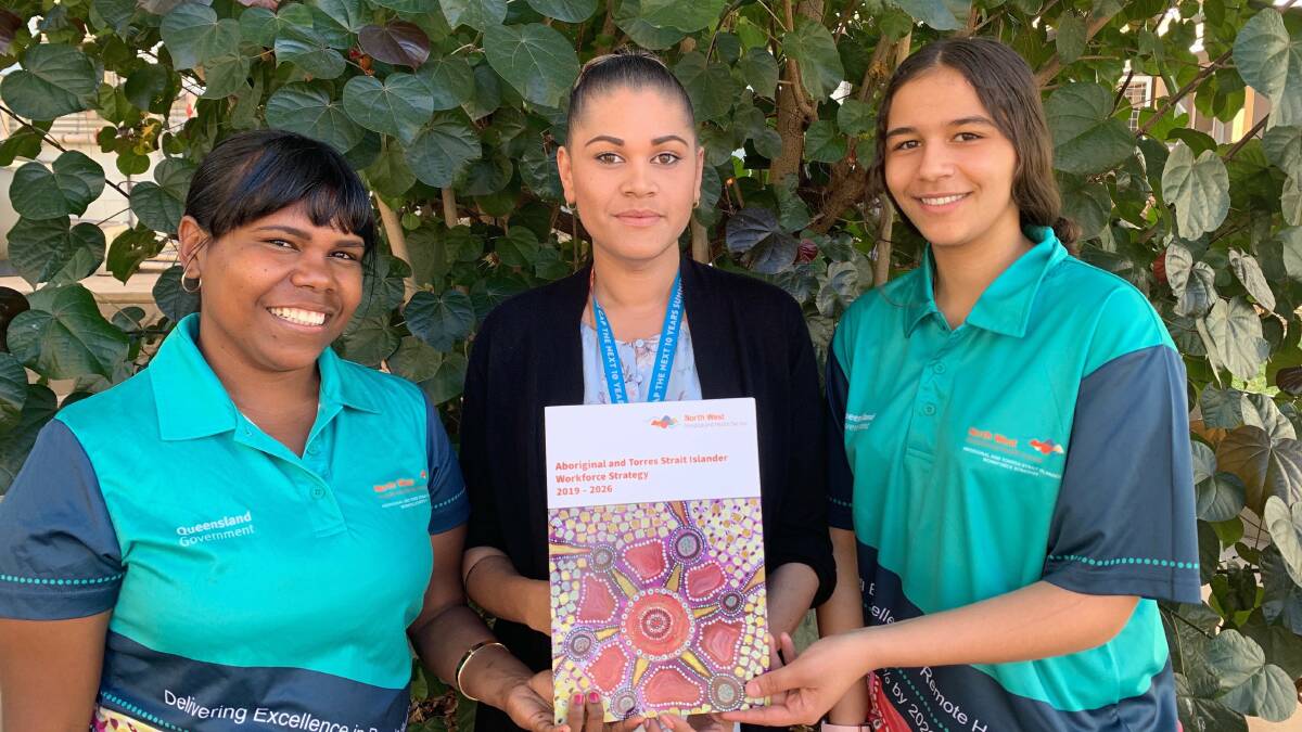 Rickisha, Shannon and Antonia holding the NWHHS Aboriginal and Torres Strait Islander Workforce Strategy 2019-2026.