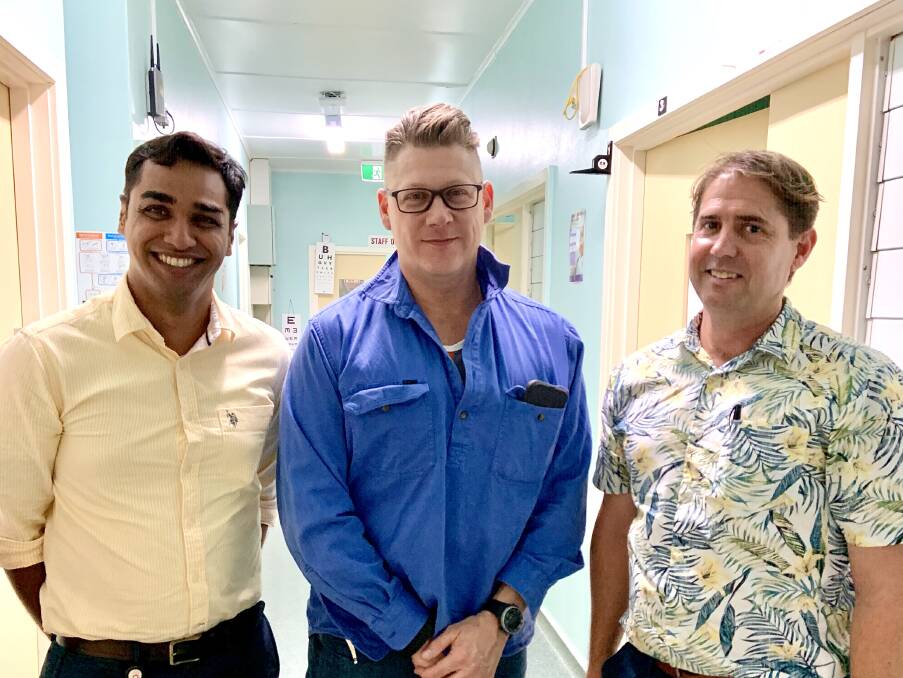 NWHHS Cardiac Nurse and Clinical Lead for the cardiac transition project, Godfrey Martis and THHS Clinical Lead Warren Cleall, discuss the new cardiac outreach services with Director of Nursing at Camooweal Primary Health Clinic, Andrew McCallum.