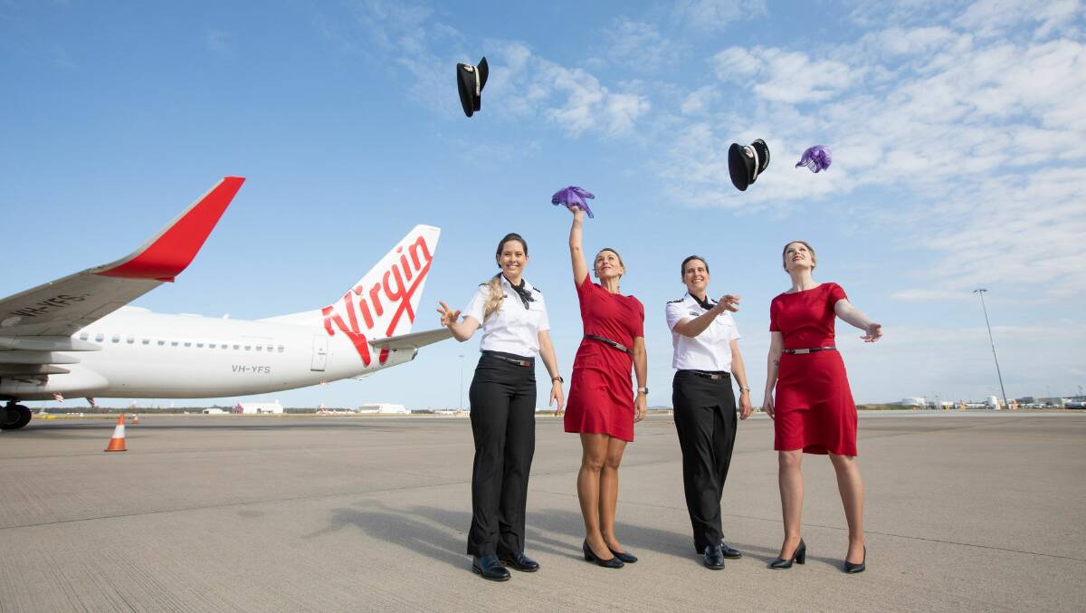 Virgin Australia staff celebrate the news of the company's sale to Bain Capital. Photo supplied.