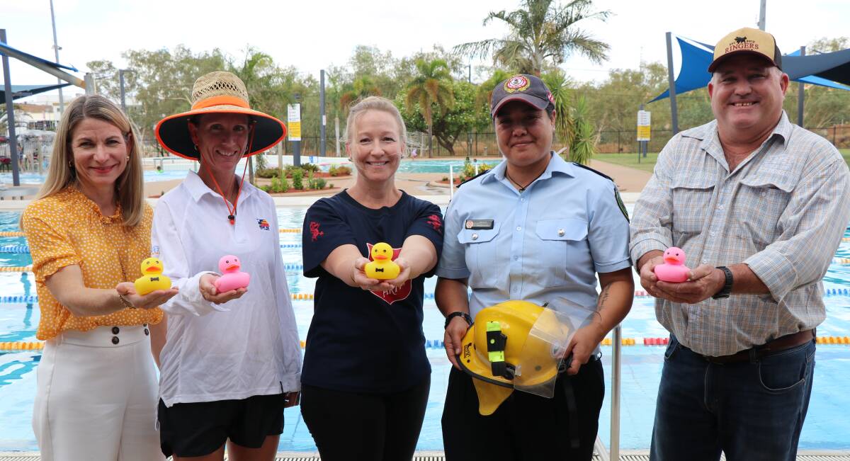 This year's Australia Day Pool Party will assist the Australian Bushfire Relief Appeal. Mayor Joyce McCulloch pictured with Splashez Lifeguard Tammy Green, Salvation Army Mount Isa Corps Officer Natalie Steele, Mount Isa Rural Fire Brigade Secretary Tina Munokoa and Councillor Paul Stretton. Photo supplied.