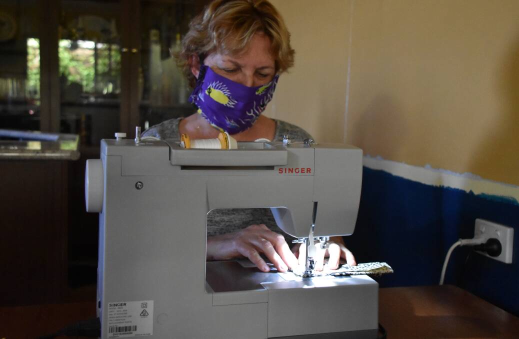 SAFE: Melonie kicks the sewing machine into gear to create personal masks for Mount Isa residents. Photo: Samantha Campbell.