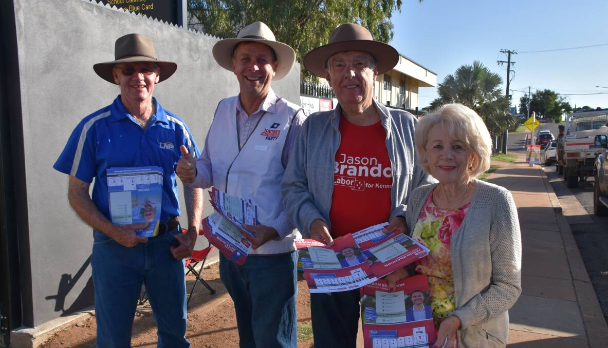 TIME TO VOTE: Brendan McNamara, David Fletcher, Tony and Sandra McGrady distribute flyers outside Central State School polling booths in Mount Isa. Photo: Samantha Campbell. 