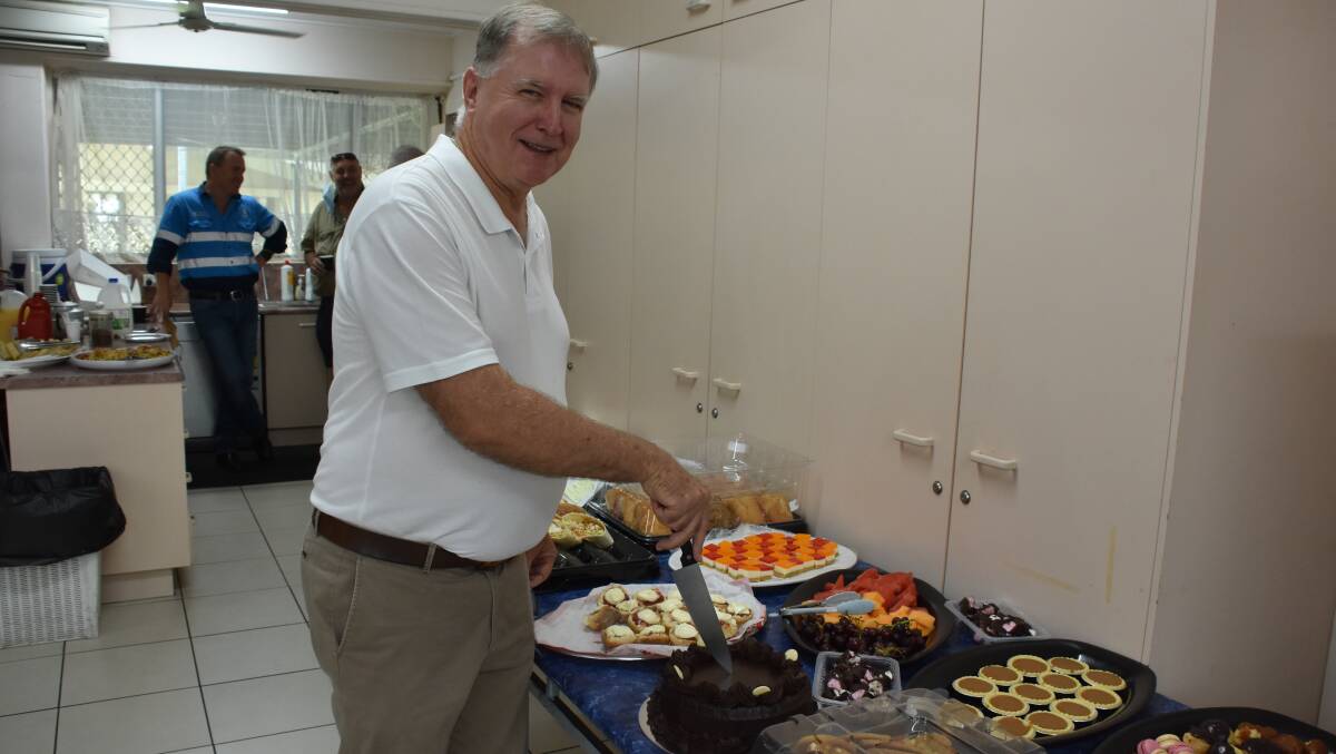 Father Mick enjoys morning tea on his 30th anniversary in Mount Isa.