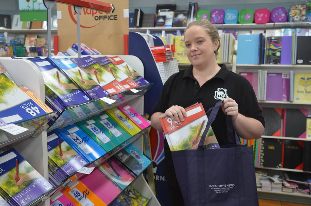 STATIONERY: McCarthy’s Newsagency manager Rebecca Heal prepares book packs for students return to school. Photo: Samantha Walton.