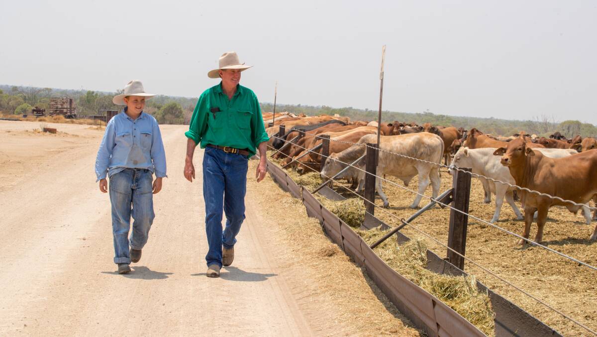 SUPPORT: Richmond grazier Corbett Tritton and son Elliott, 11 inspect their herd. Photo supplied.