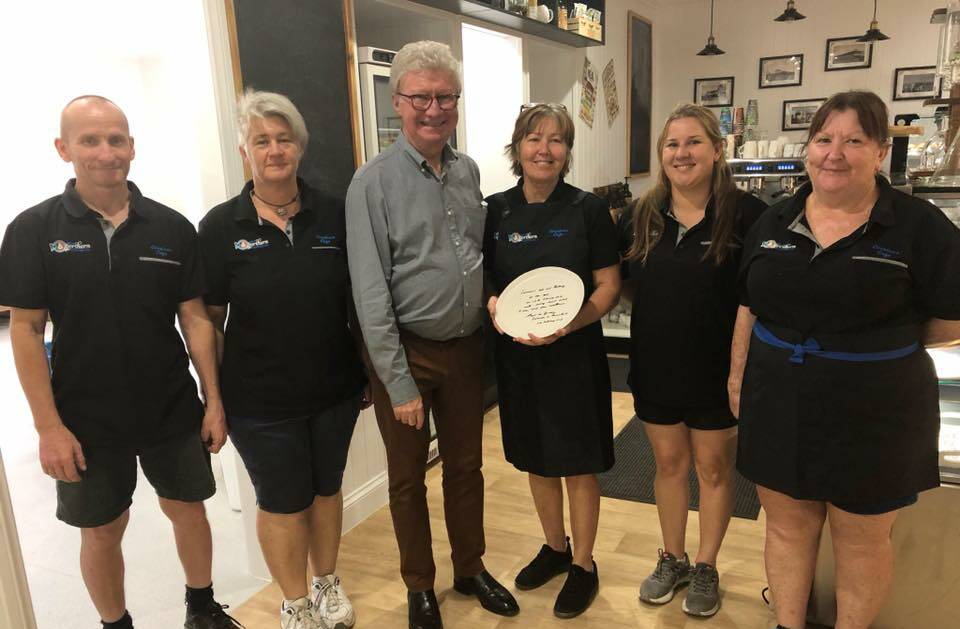 The Governor of Queensland Paul de Jersey with business owner Corrina Sollitt and her team having a pre-opening sneak peak. Photo supplied.