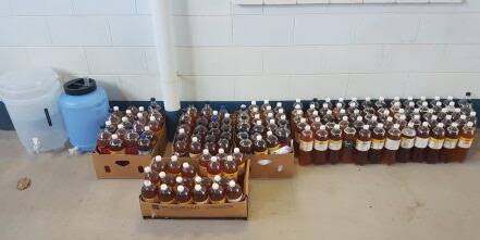 139 bottles of home brew alcohol. Photo supplied.