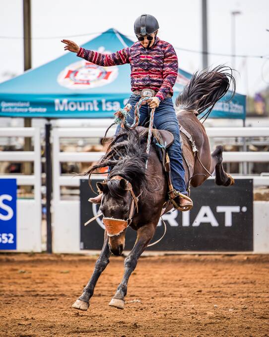 Emily Howkins competing in the Local Station Buckjump at the Isa Rodeo. Photo supplied.