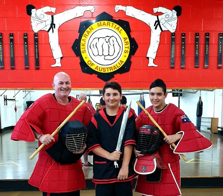 Father and sons, Chris, Patrick and Thomas Roche will travel to Melbourne to compete in the Australian National WEKAF Championships. Photo supplied.
