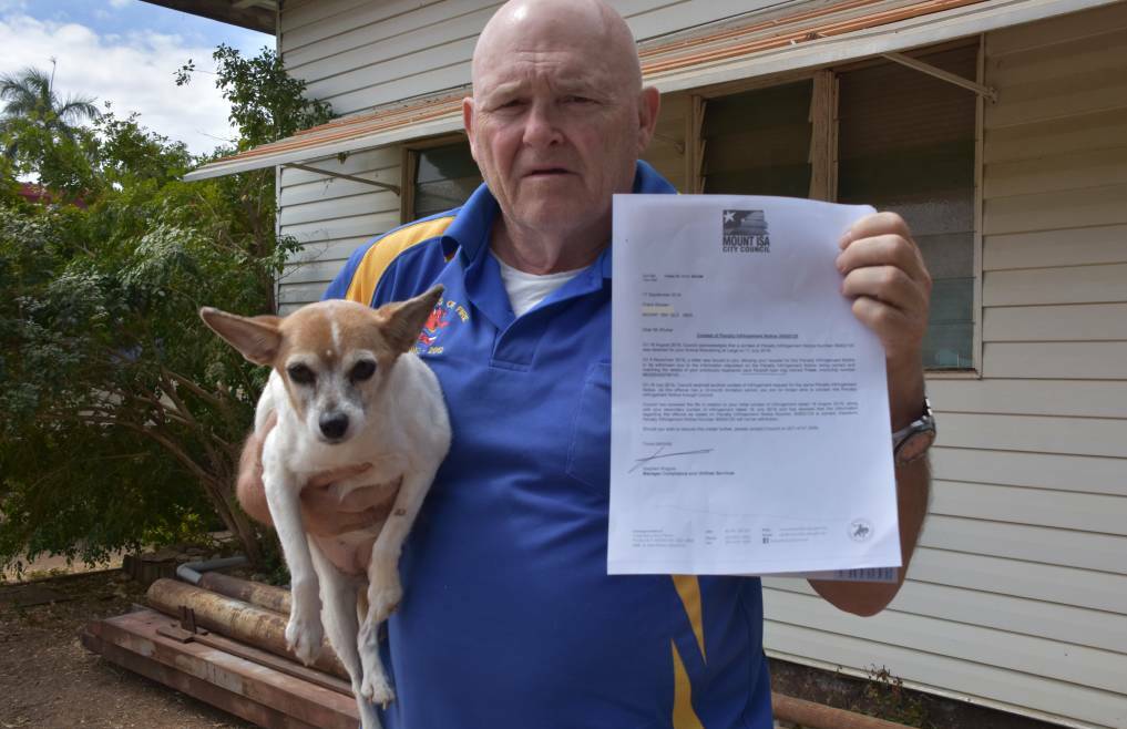 NOT MY DOG: Frank Shuker shows his letter from Mount Isa City Council stating he was to pay the fine. Photo: Samantha Walton.