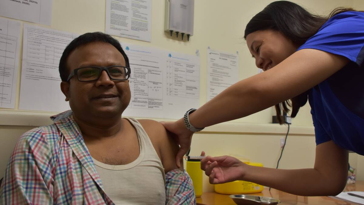 Dr Kazi Rahmen was the first to receive the vaccine at Mount Isa Medical Centre.