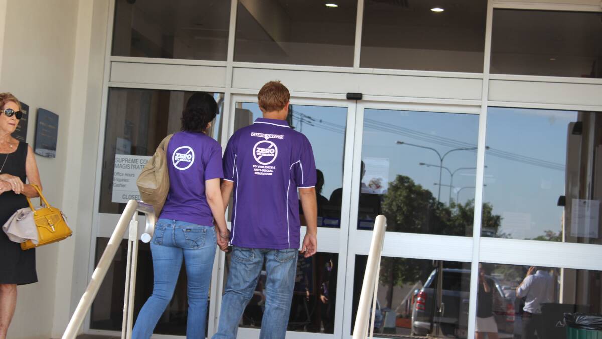 Melissa Abdoo and her partner Jason Weckert enter the court house.