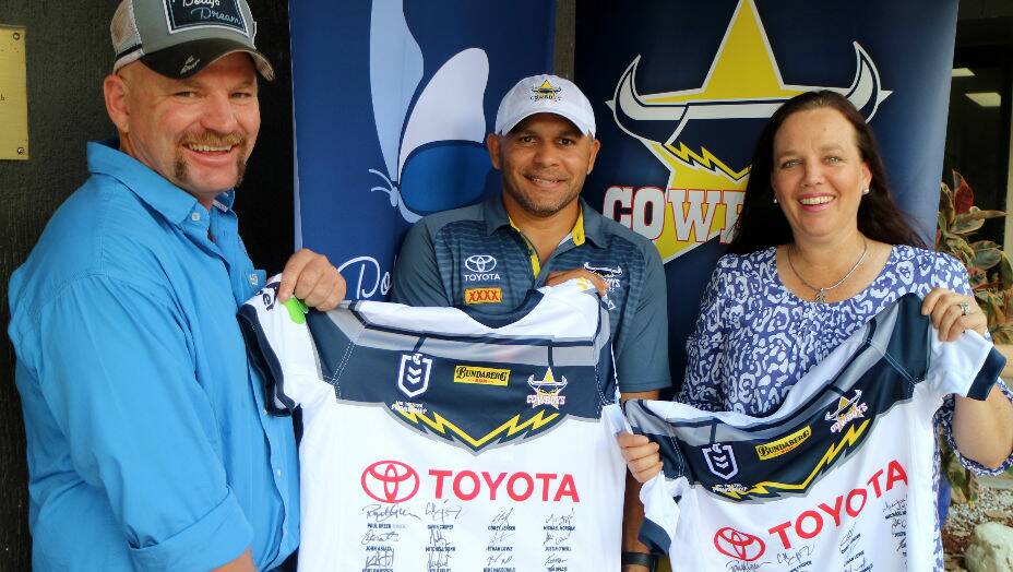 Dollys Dream founders, Tick and Kate Everett, with former Cowboys legend Matty Bowen (middle). Photo supplied.