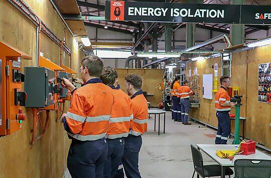 Apprentices learning about the importance of energy isolation.
