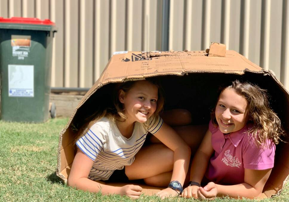 Ruby and Lilly Rixon took part in the Bin Isolation Outing challenge in a cardboard box. Photo supplied.