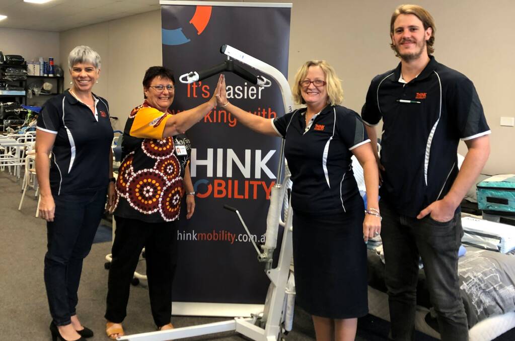 NWRH North Queensland Manager Sonya Hill and Clinical Nurse Consultant Lyn Tattersall take ownership of the new Mobile Hydraulic Hoist with thanks to Think Mobility Townsville, pictured with Sales Administrator/Team Leader Sharyn Adams and Product Specialist Ethan Marano. Photo supplied.