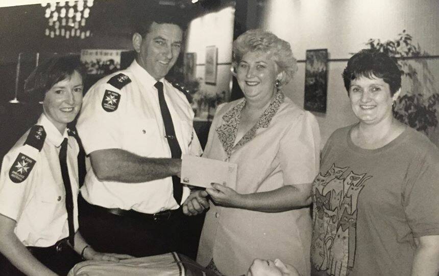 Jean Ferris presents a cheque to St Johns Ambulance.