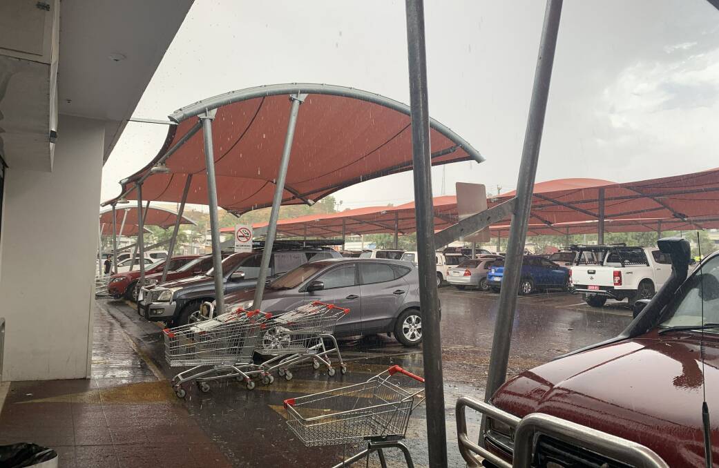 Rain pours at the Kmart shopping complex. Photo: Samantha Campbell.