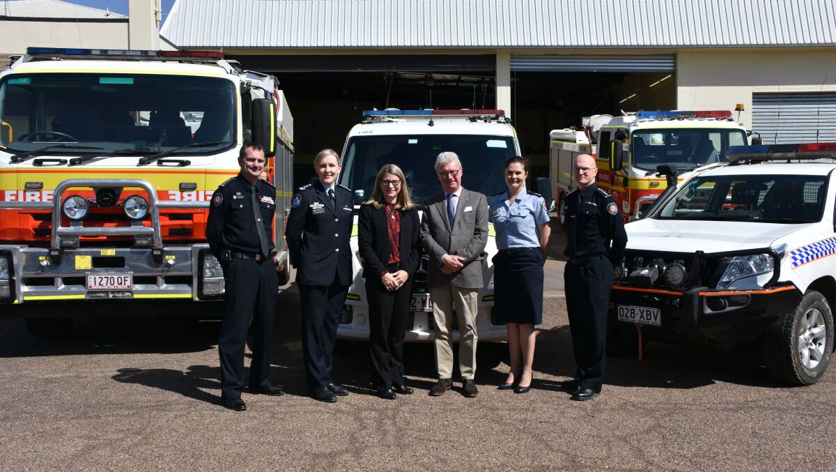 MEET: The Governor of Queensland Hon Paul de Jersey consults with emergency service personnel. Photo: Samantha Walton.