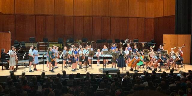 The students performing in orchestra at the State Honours Ensemble Program 