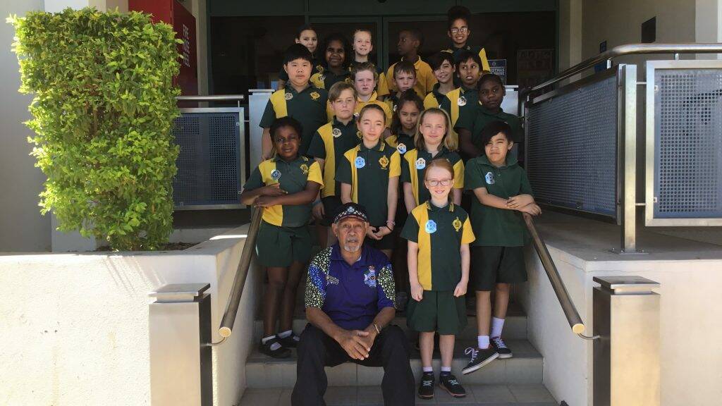PLO George Leon with Healy State School students outside the Mount Isa Police Station.