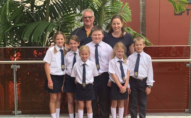 Chairman of the Apex foundation Tony Wilshire and Cara Taggart with School of the Air students before their performance in Brisbane.