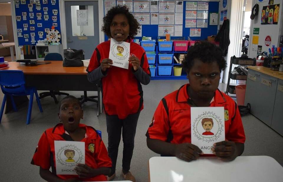 Students at the Mount Isa Special School reenacting their chosen alphabet cards. Photo: Supplied. 