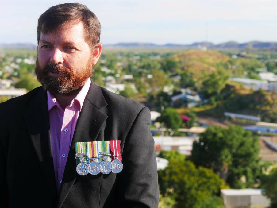 Rob Elliot looks back on his career in the Navy at the Mount Isa lookout. Photo: Aidan Green.