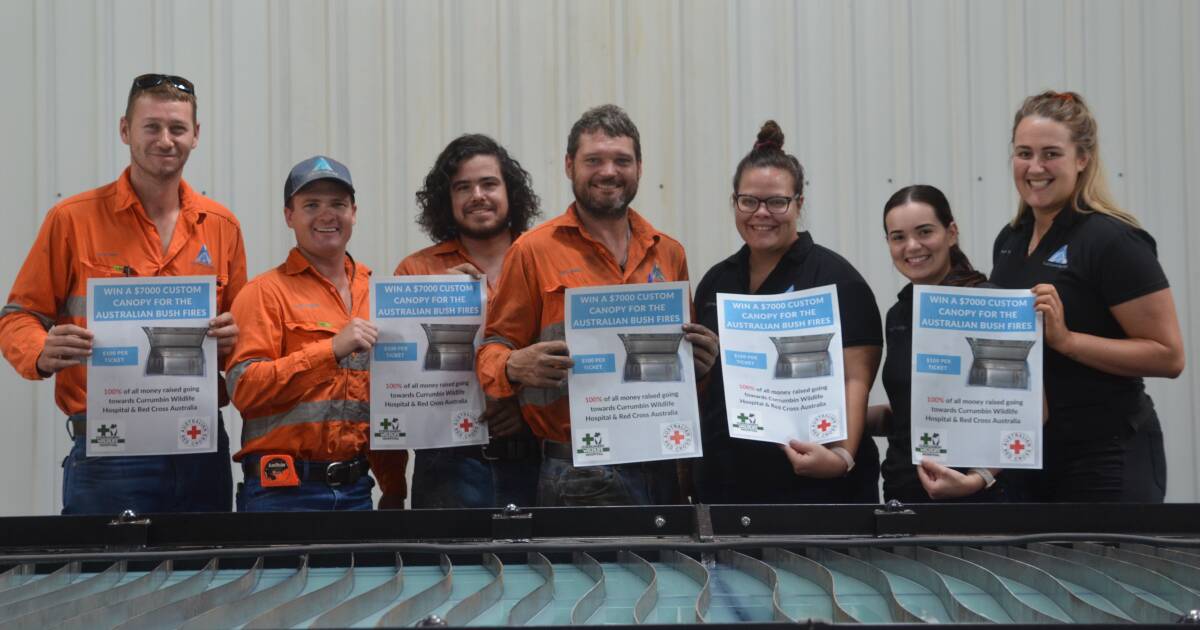 HANDS OF STEEL: Terry Foster, Travis McElligott, Kerry Ham, Luke Reeve, Sharnee Lloyd, Rachael McElligott and Phoebe Russ holding up posters for the fundraiser. Photo: Aidan Green. 