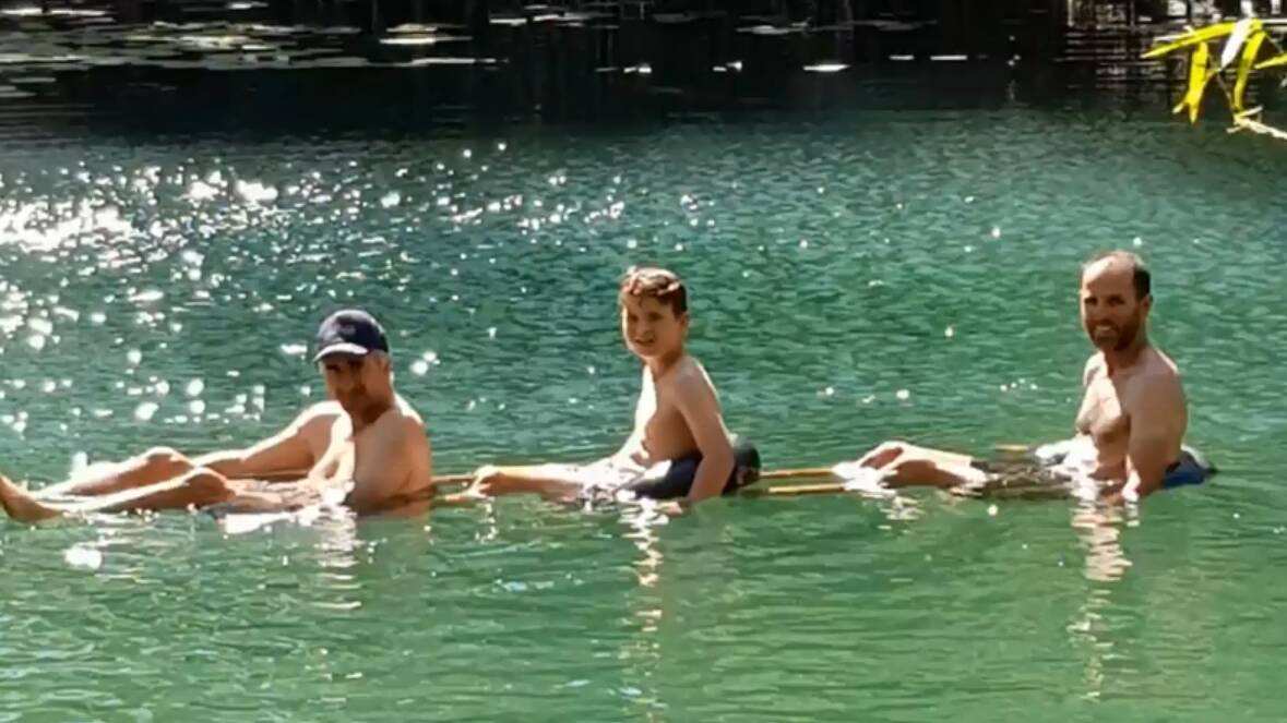 BACK ON ITS FEET: Three swimmers enjoying the water. Photo suplied. 