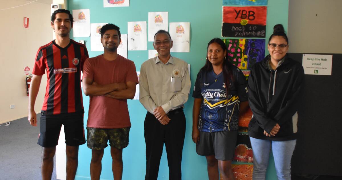 COMMUNITY: Vincent Bin Dol (middle) and his staff at the Mount Isa Transitional Hub. Photo: Aidan Green.
