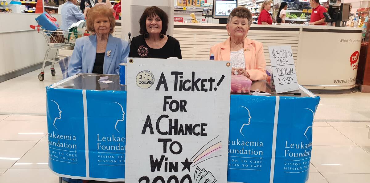 Joyce Nielson, Elaine Gamer and Kath Swift selling raffle tickets outside Coles. 