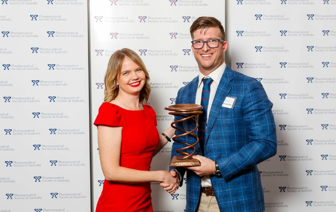Selina Taylor is presented the Pharmacist of the Year award by Shane MacDonald at the Pharmaceutical Society of Australia's awards night on Wednesday. Pictures: supplied. 