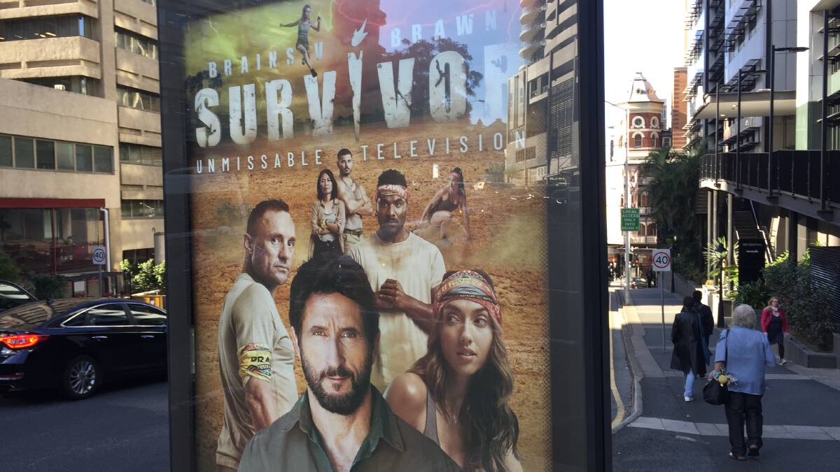 A bus stop in Brisbane advertises Australian Survivor which was shot in Cloncurry.