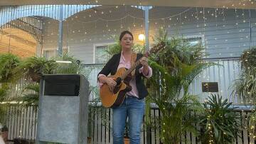 Sara Storer performs at the Bush Poets Breakfast.