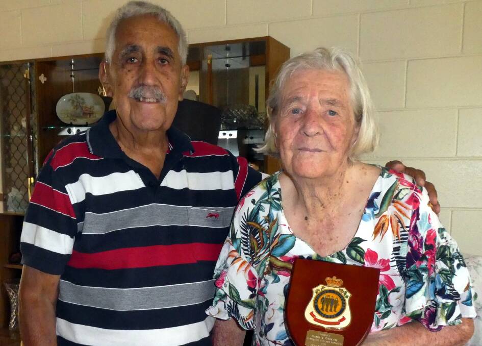 ACE OF DIAMONDS: RSL Welfare Officer Peter Smith presents Connie Greaves a plaque celebrating her 60 years of membership of the Mount Isa RSL. Photo: supplied