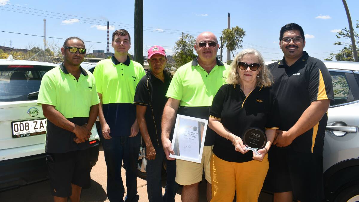 Terry and Alison Dowling (third and second right) with Hertz Mount Isa staff and their new award.