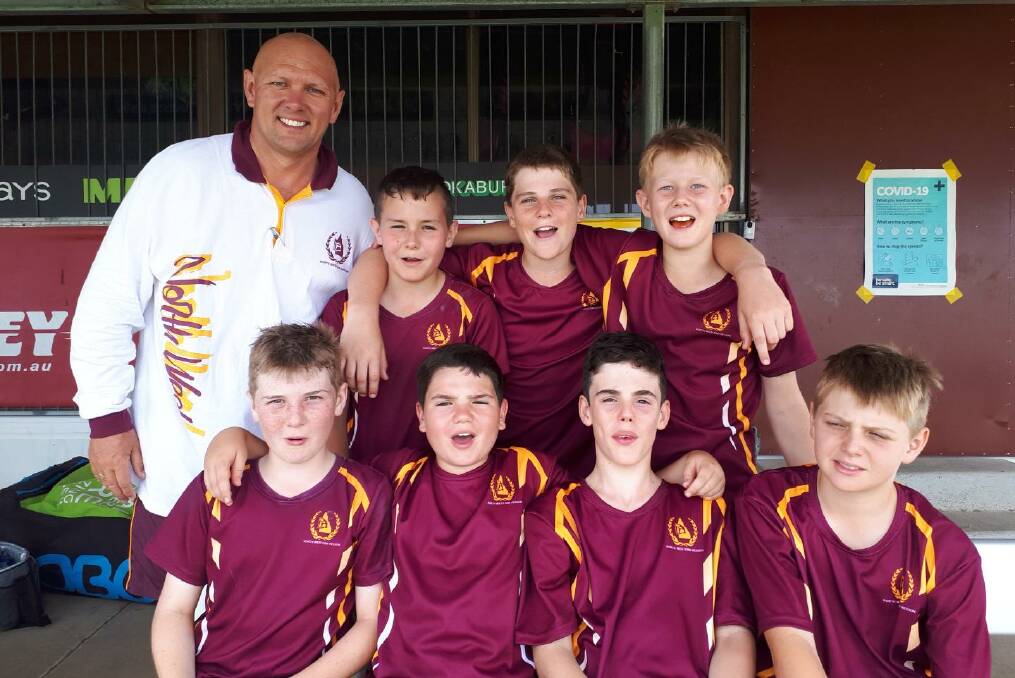 Manager Chris Pocock with the seven Mount Isa boys in Ipswich.