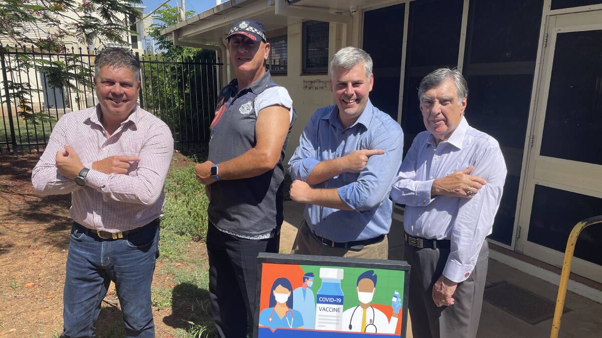 Aaron Harper MP, Assistant Police Commissioner Paul Taylor, Emergency Services Minister Mark Ryan and Tony McGrady want people to roll up their sleeves and get vaccinated.