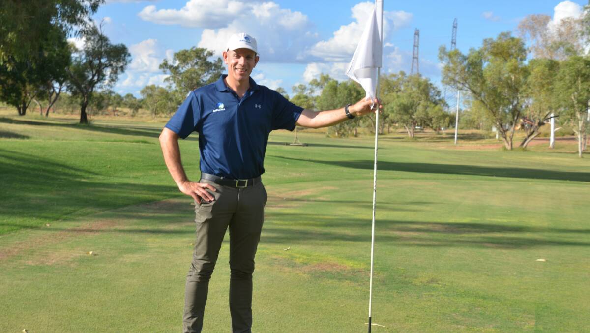 FAIR WAY: Golf Australia's Luke Bates at Mount Isa's 18th green. The hole will be changed to a Par 3 for the hole-in-one challenge. Photo: Derek Barry