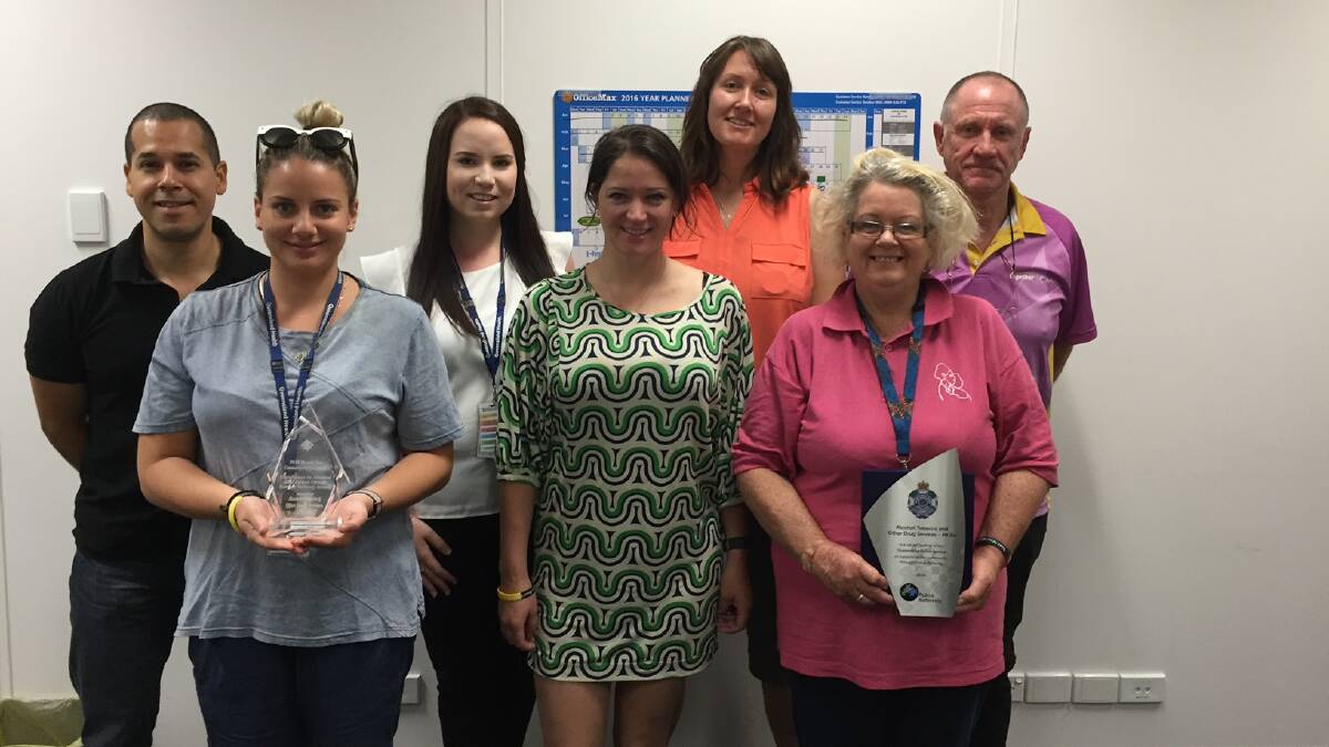 The ATODS team with their Community Service award, and their Queensland Police Service award.