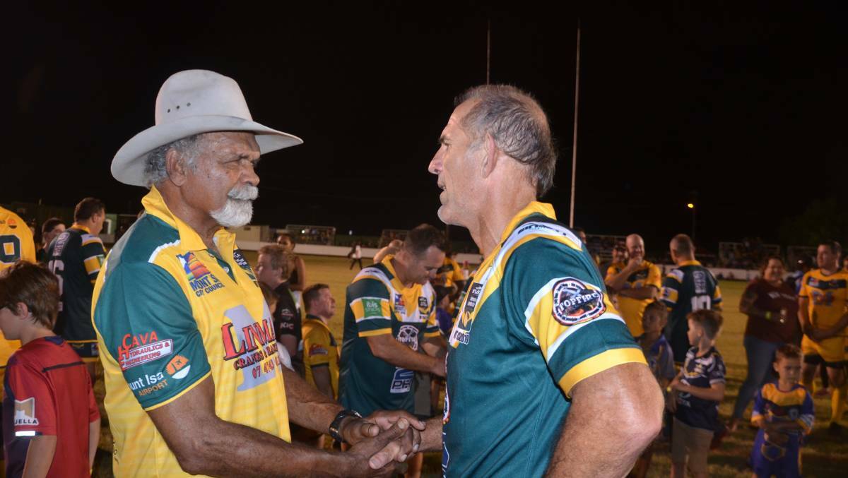 Mount Isa All Stars coach Vern Daisy shakes hands with Australian Legend Peter Gill after the 2019 game. Both men will return for the 2021 clash.